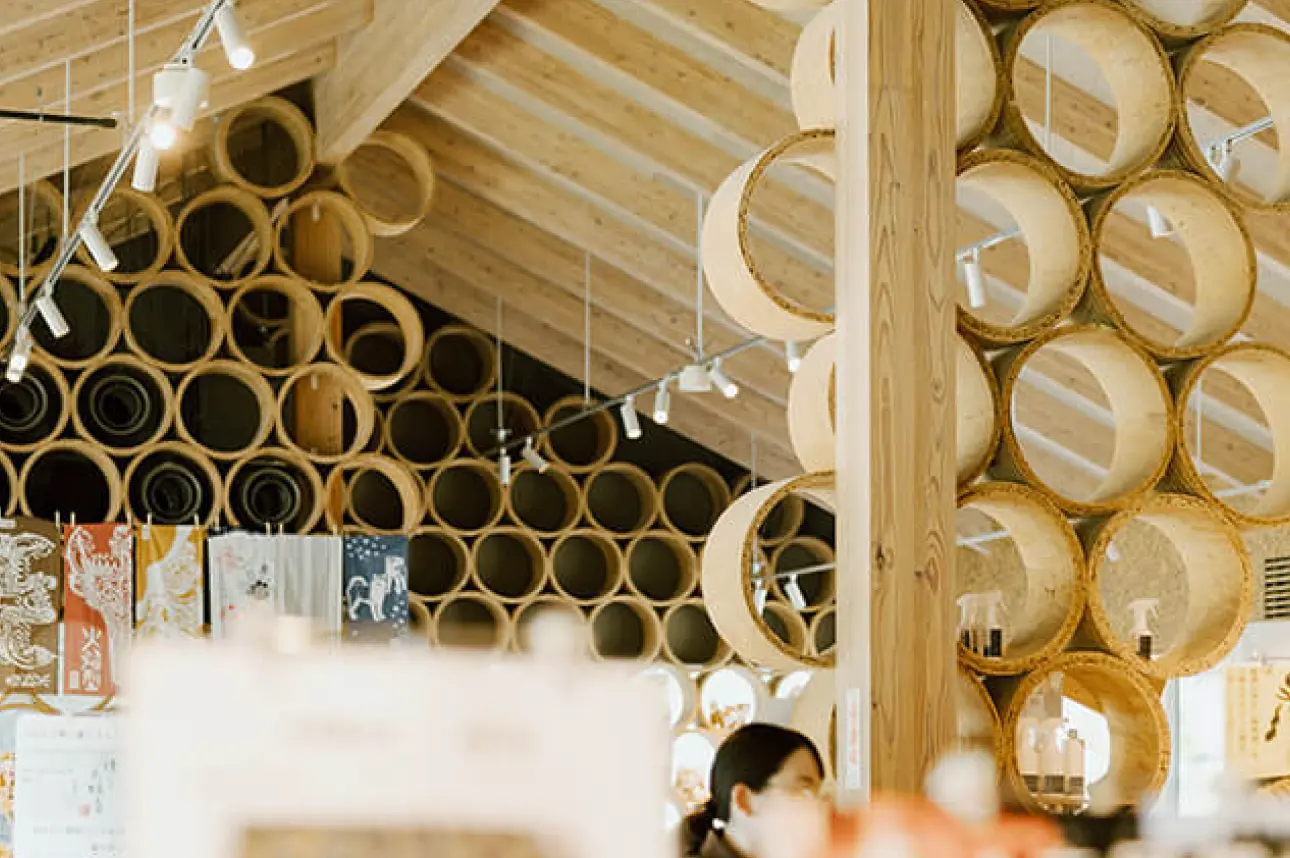 View of the COI-NEXT project exhibition. The ceiling and walls are decorated with Akita wood materials