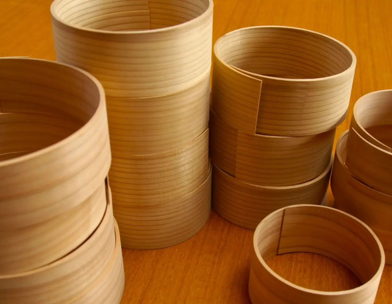 Close-up photo of handmade wooden cylindrical containers
